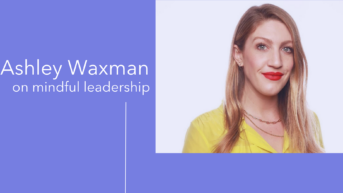 a woman with long hair wearing a yellow shirt