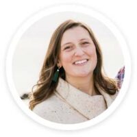 a woman with long hair wearing a scarf