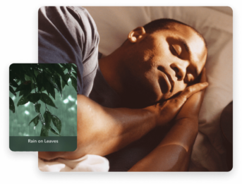 a man laying in bed with his hands on his chest