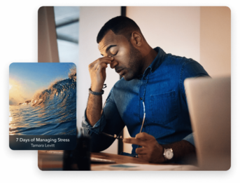 a man sitting in front of a laptop computer