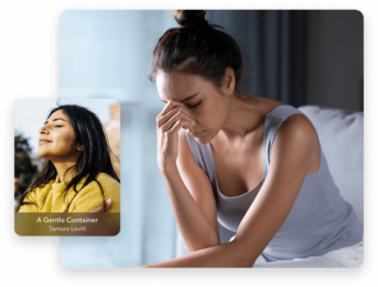 a woman holding her hand to her face