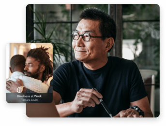 a man with glasses is looking at the camera