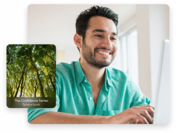 a man smiling and looking at the camera