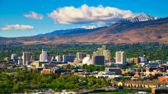 a city with mountains in the background