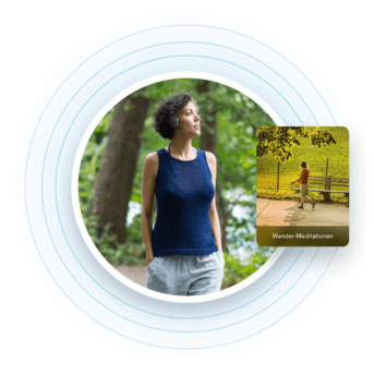 a woman standing in front of a park bench