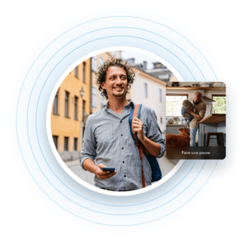 a man with curly hair holding a cell phone