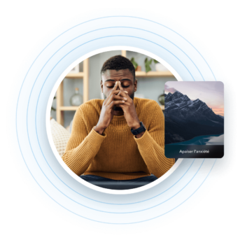 a man sitting in front of a laptop computer