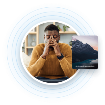 a man sitting at a desk with his hands to his face