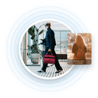 a man walking with a red bag in his hand