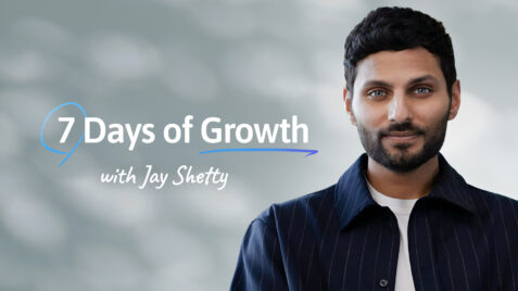 a man in a blue shirt and tie with the words 7 days of growth
