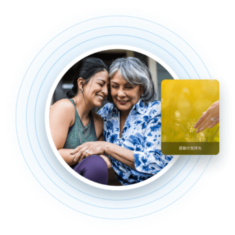 two women hugging each other in front of a credit card