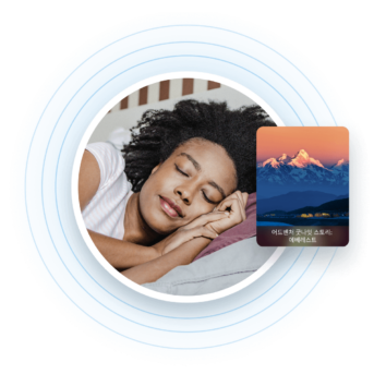 a woman sleeping in bed next to a credit card