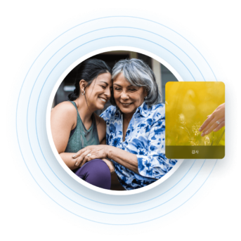 two women hugging each other in front of a credit card