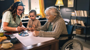 Caregiver with child and elderly parent