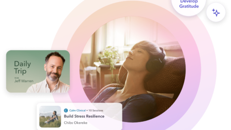 a man and a woman sitting on a couch in a living room