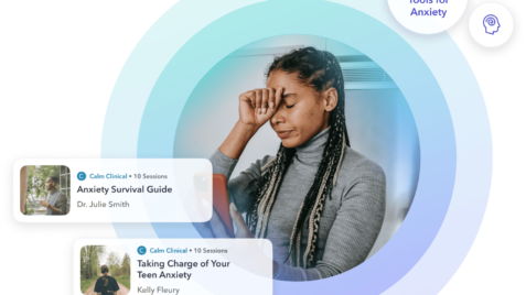 a woman with braids is looking at her phone