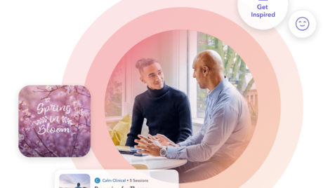 a couple of men sitting next to each other