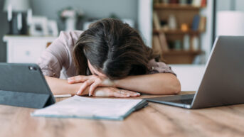 Tired employee is not getting enough sleep