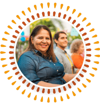 a woman standing in front of a group of people