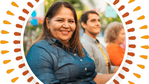 a woman standing in front of a group of people