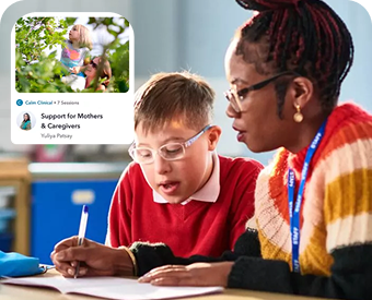 a woman and a boy sitting at a table