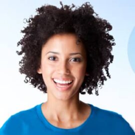 a woman with a blue shirt is smiling