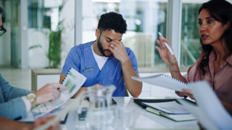 Male healthcare worker shows signs of burnout