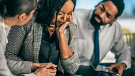 Woman experiencing grief and loss in the workplace